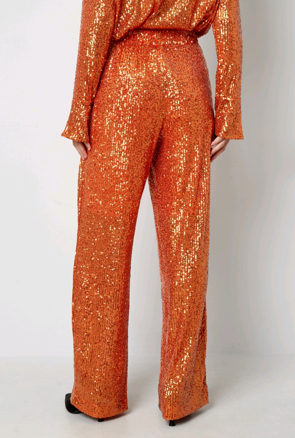 Glitzernde Paillettenhose in Kupfer-Orange